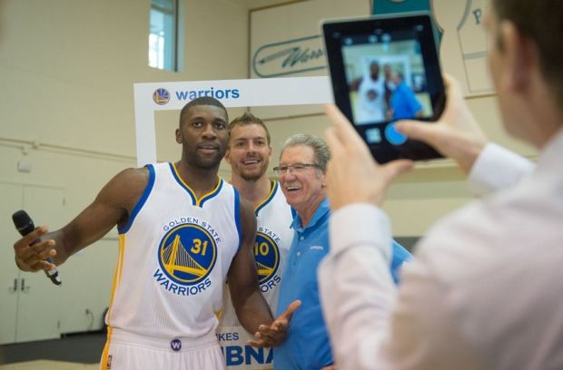 September 29, 2014; Oakland, CA, USA; Golden State Warriors center Festus Ezeli (31), forward David Lee (10), and broadcaster Jim Barnett (right) pose for an Instagram photo during media day at the Warriors Practice Facility. Mandatory Credit: Kyle Terada-USA TODAY Sports