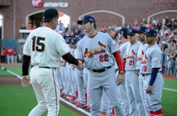 Oct 14, 2012; San Francisco, CA, USA; St. Louis Cardinals manager Mike Matheny (22) shakes hands with San Francisco Giants manager Bruce Bochy (15) before game one of the 2012 NLCS at AT&T Park.  Mandatory Credit: Jayne Kamin-Oncea-USA TODAY Sports
