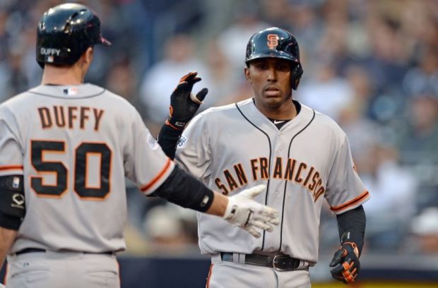 Apr 11, 2015; San Diego, CA, USA; San Francisco Giants third baseman Joaquin Arias (13) is congratulated by second baseman Matt Duffy (50) after hitting a solo home run during the fourth inning against the San Diego Padres at Petco Park. Mandatory Credit: Jake Roth-USA TODAY Sports